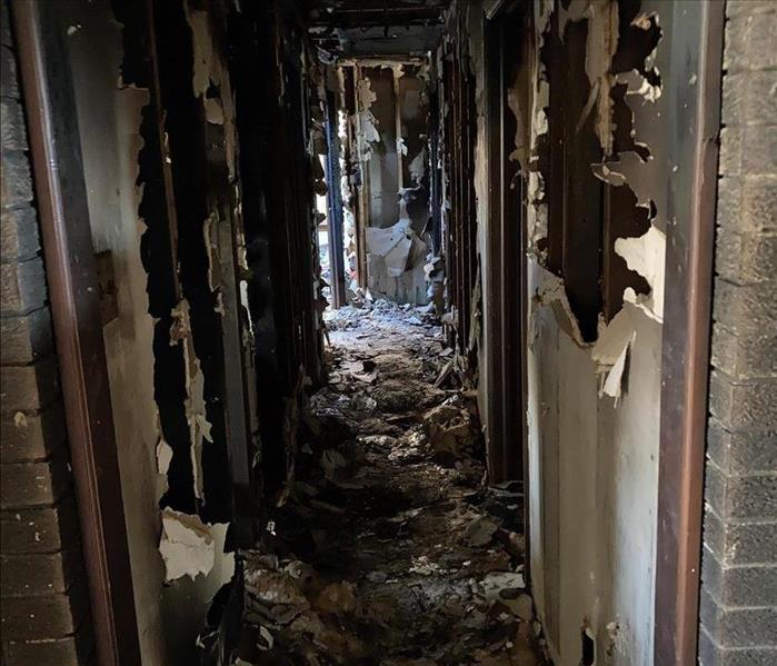 fire damage and debris in hallway