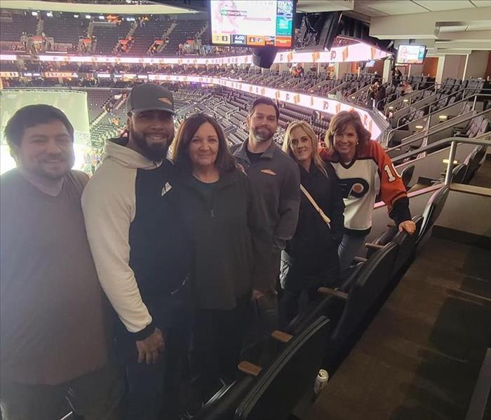 SERVPRO team and Chamber directors at flyers game